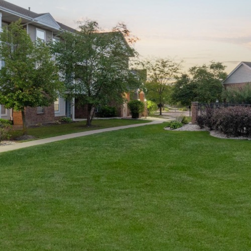 The essence of exceptional living a large green lawn in front of a house