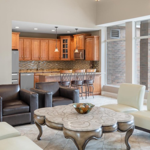 The essence of exceptional living a social room with a table and chairs
