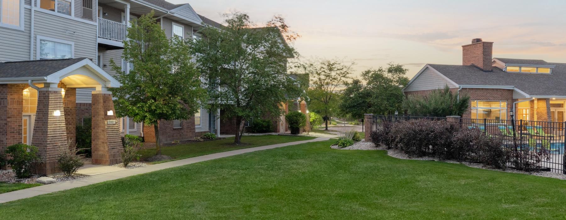 a large green lawn in front of a house