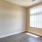 bedroom with a window and wood-style flooring