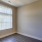 bedroom with window and wood-style flooring