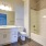 bathroom with white cabinets