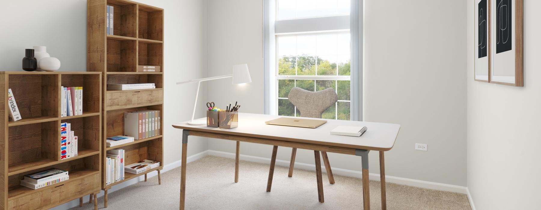 a room with a desk and bookshelves